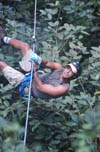 Looking Down at Man on Zipline of Canopy Tour